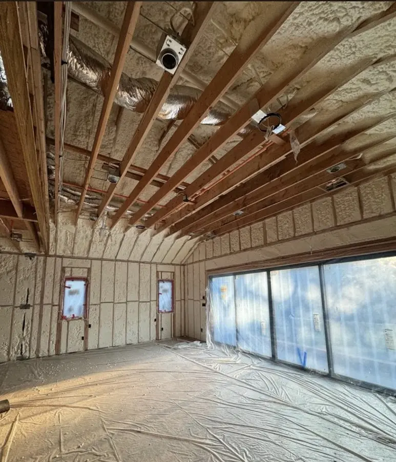 Interior walls and ceiling insulated with spray foam during new construction in New Carlisle